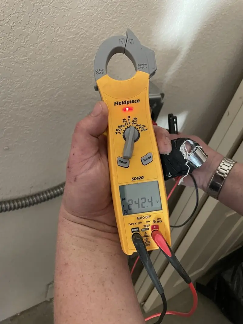 Voltage testing with clamp meter during Recessed Lighting Installation in York